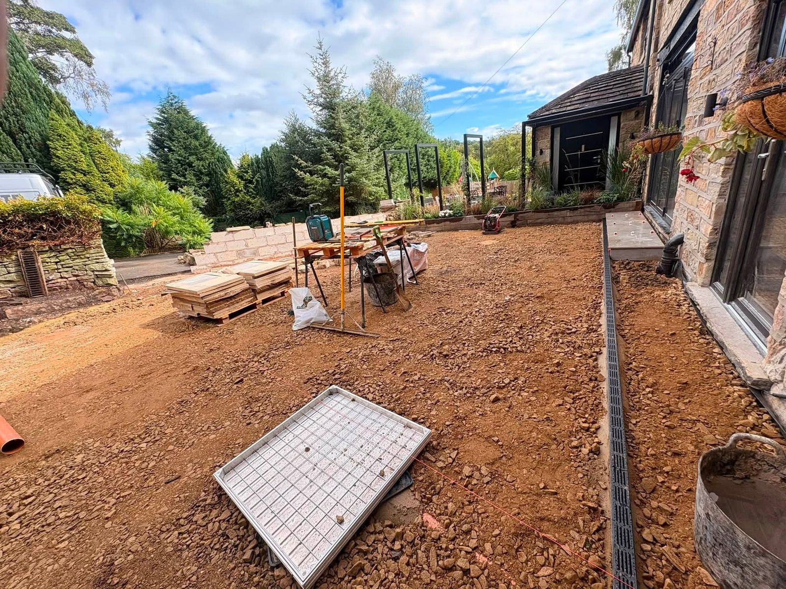 Garden groundworks and sub-base preparation ahead of a patio installation by DB Landscapes Ltd in Stockport